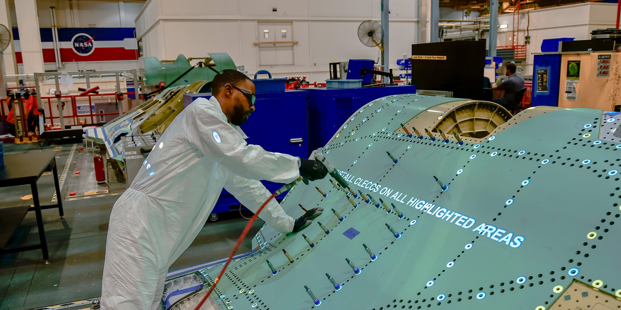 Black man riveting fuselage