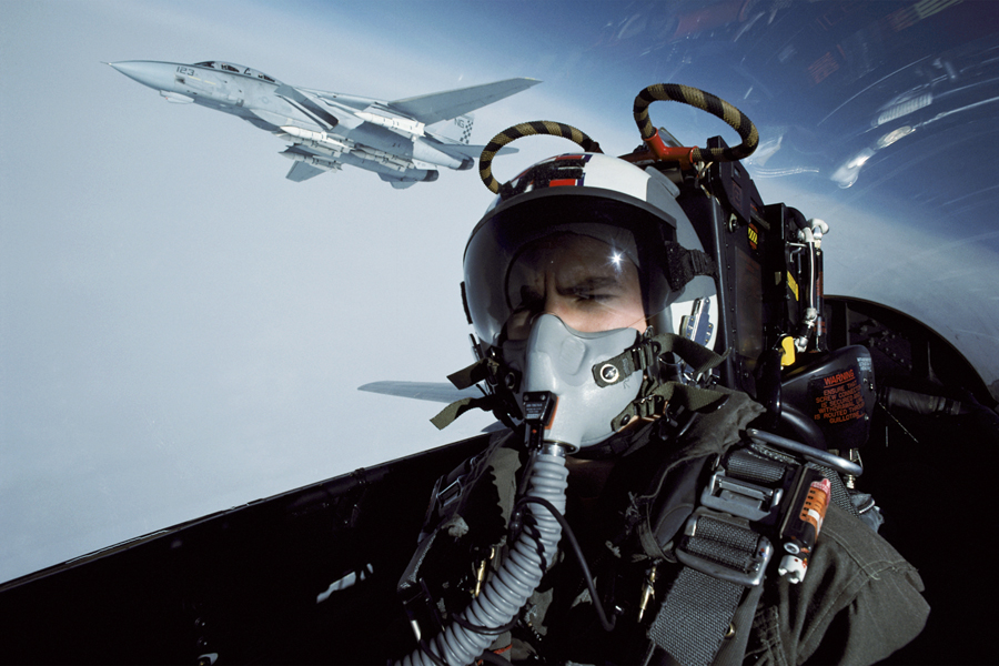 A pilot inside a jet in flight