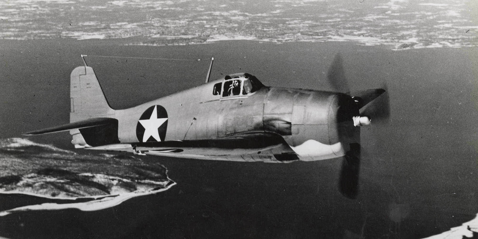 Community Spotlight: Bethpage World War II military airplane flying above New York