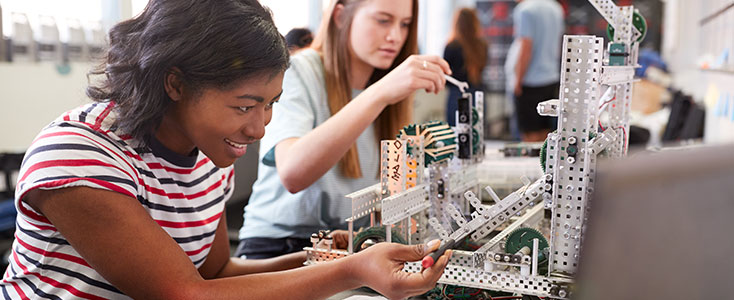 students working with engineering tools