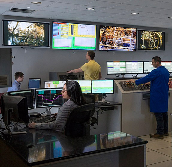mach-speed-hypersonics-testing-lab-northrop-grumman control room with many screens and several people working on computers