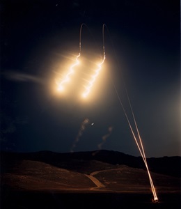 illuminating flares light up night sky