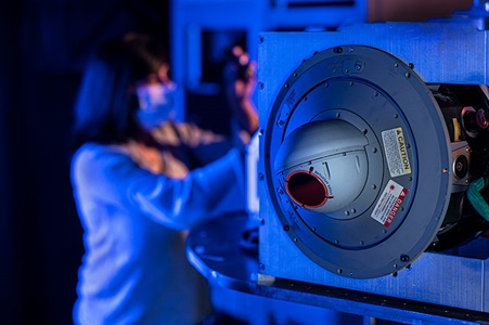 woman working on infrared radar in lab