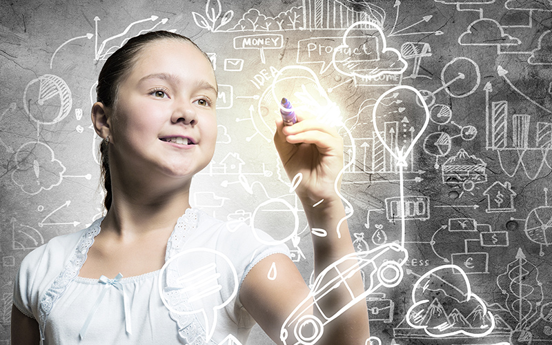 STEM Education Resources Young white female writing on board