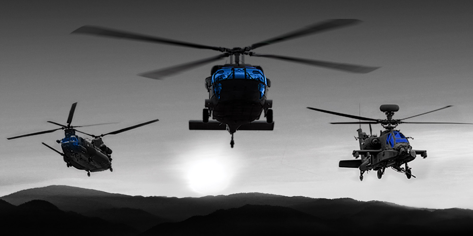 3 helicopters flying in night sky