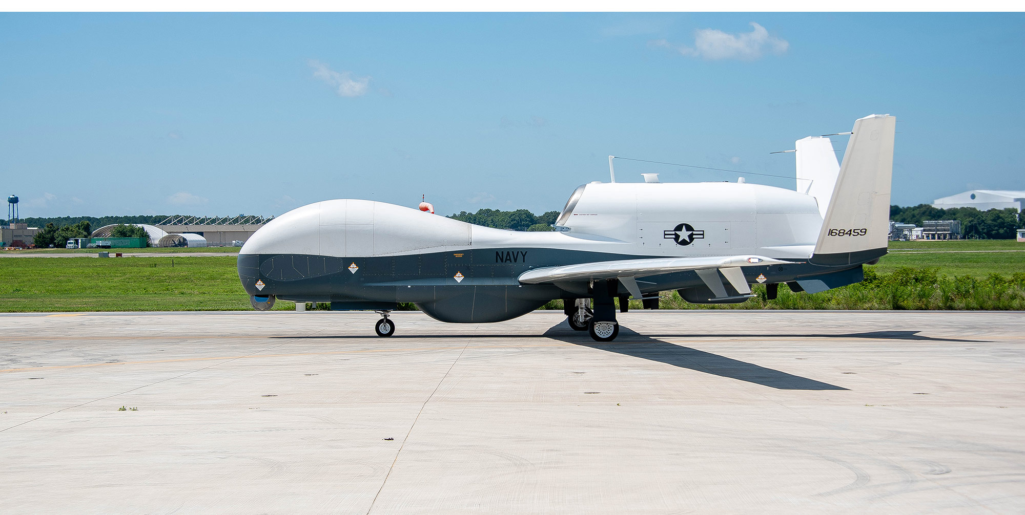 A triton aircraft sits on the runway