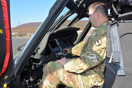 pilots sitting in Black Hawk helicopter