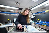 Female employee working in a manufacturing/assembly facility