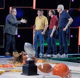 four males talking to each other