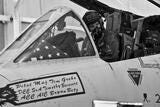 Caucasian male in uniform inside cockpit