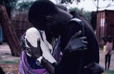 African American Male hugging mother 
