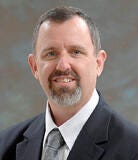 White male in suit