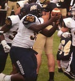 male catching football