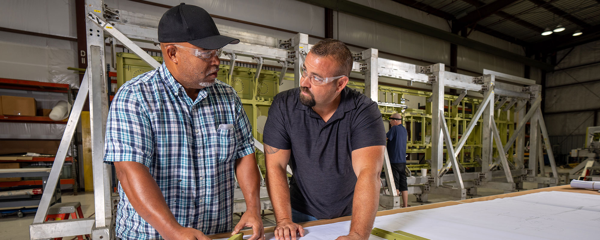 two men at drafting table