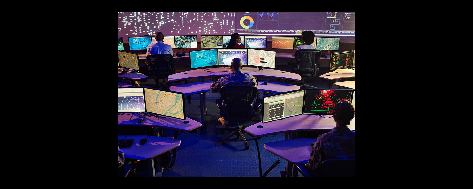 people in front of computer screens