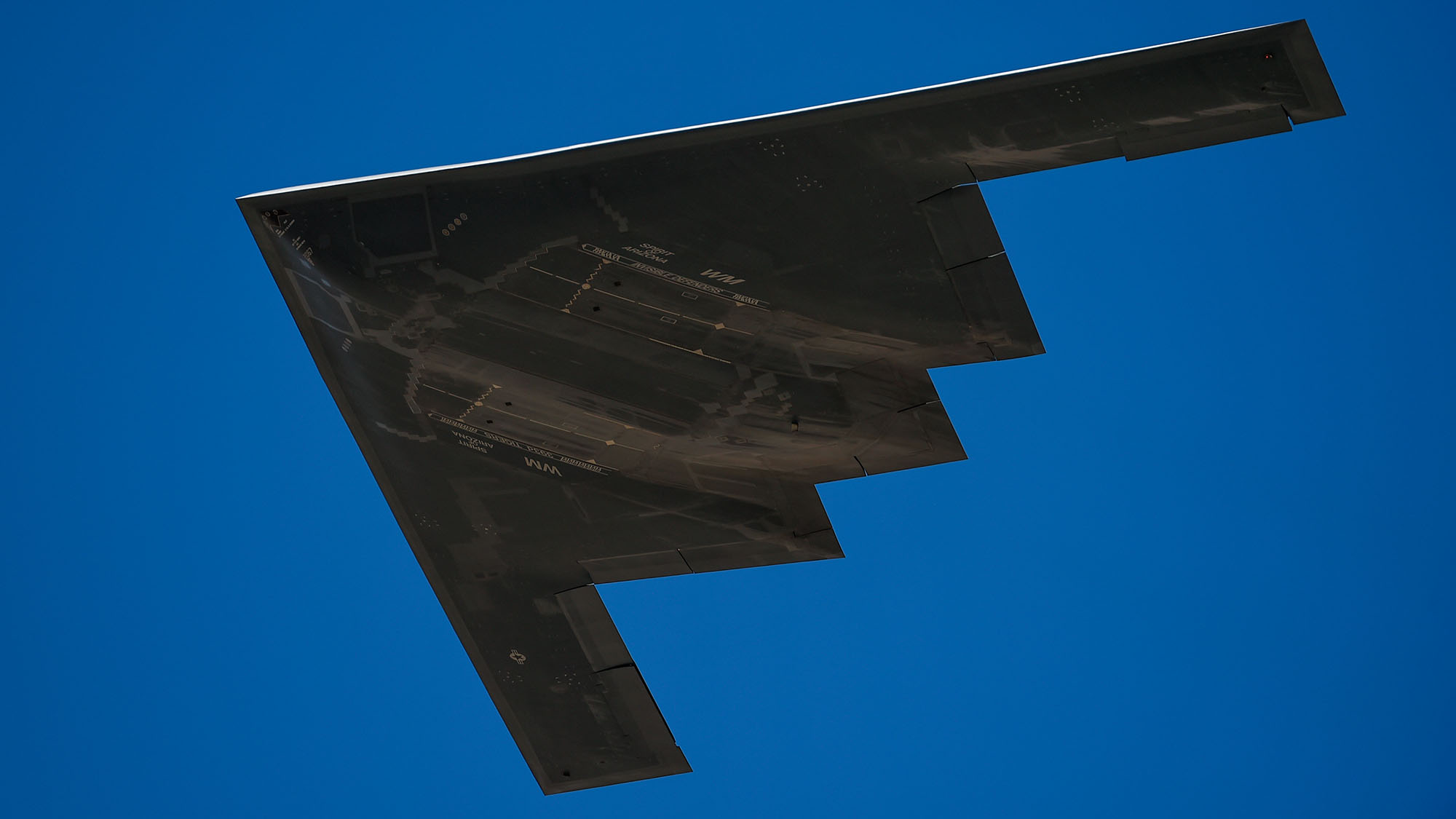 B-2 Spirit Stealth Bomber 140717pmar352254 Bottom of B-2 Spirit Stealth Bomber flying in blue skies