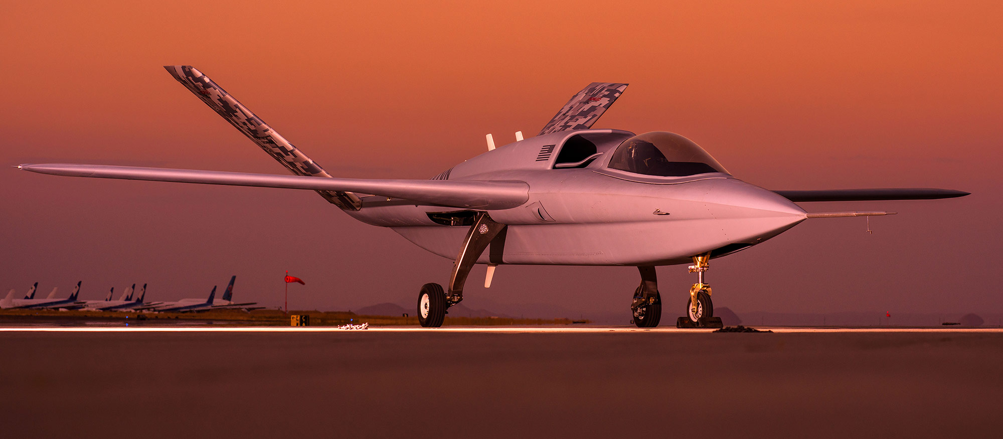 aircraft on runway at sunset