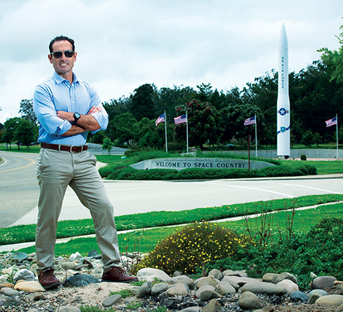 man standing in front of missle model