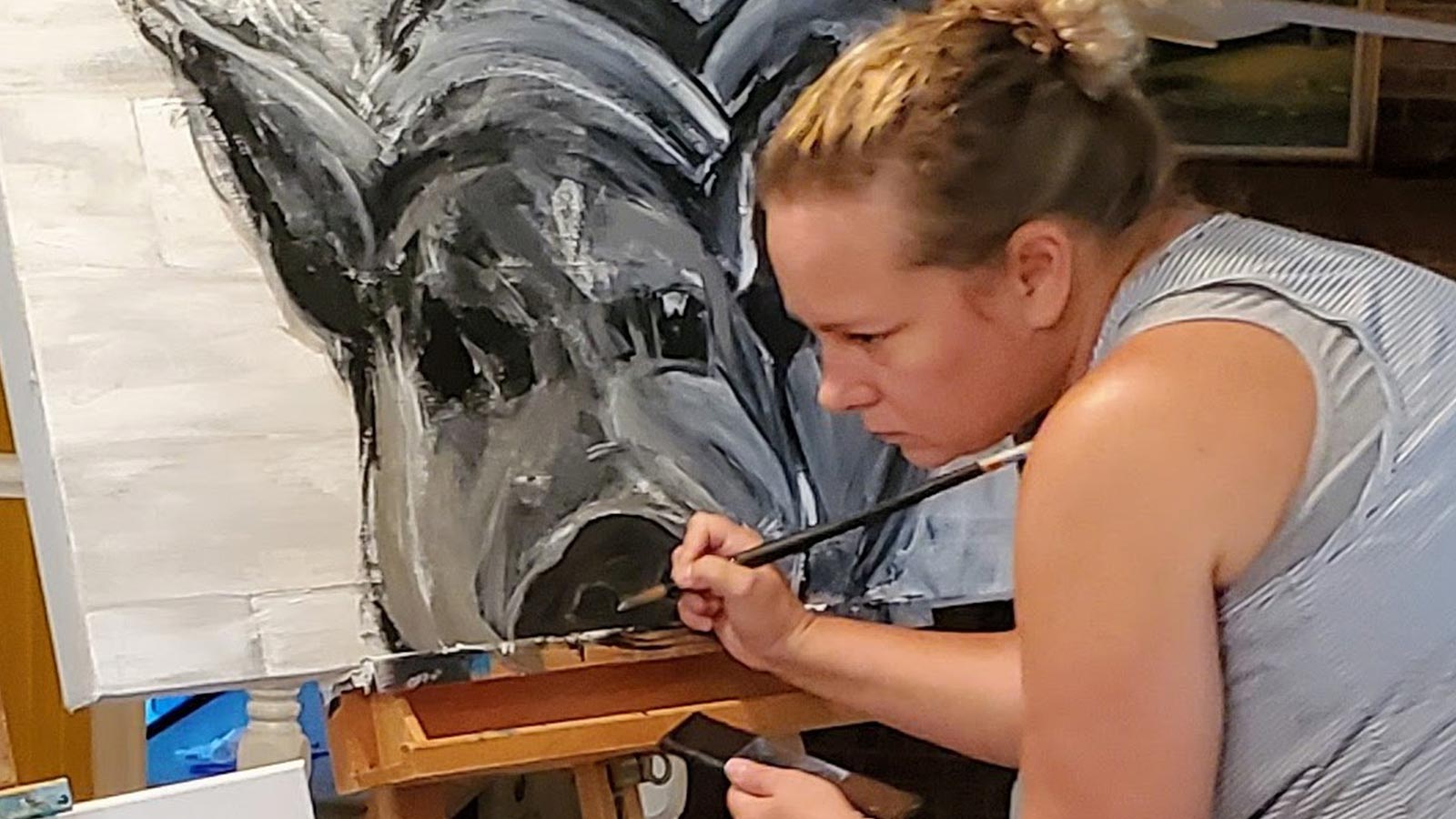 Painting of a woman painting a hog