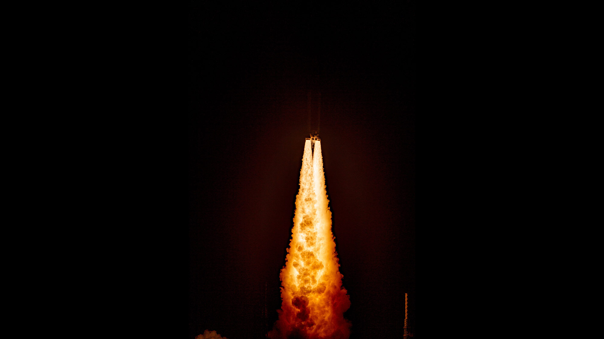 The five-segment solid rocket boosters powering the first SLS flight for Artemis I Artemis I taking off from launch pad