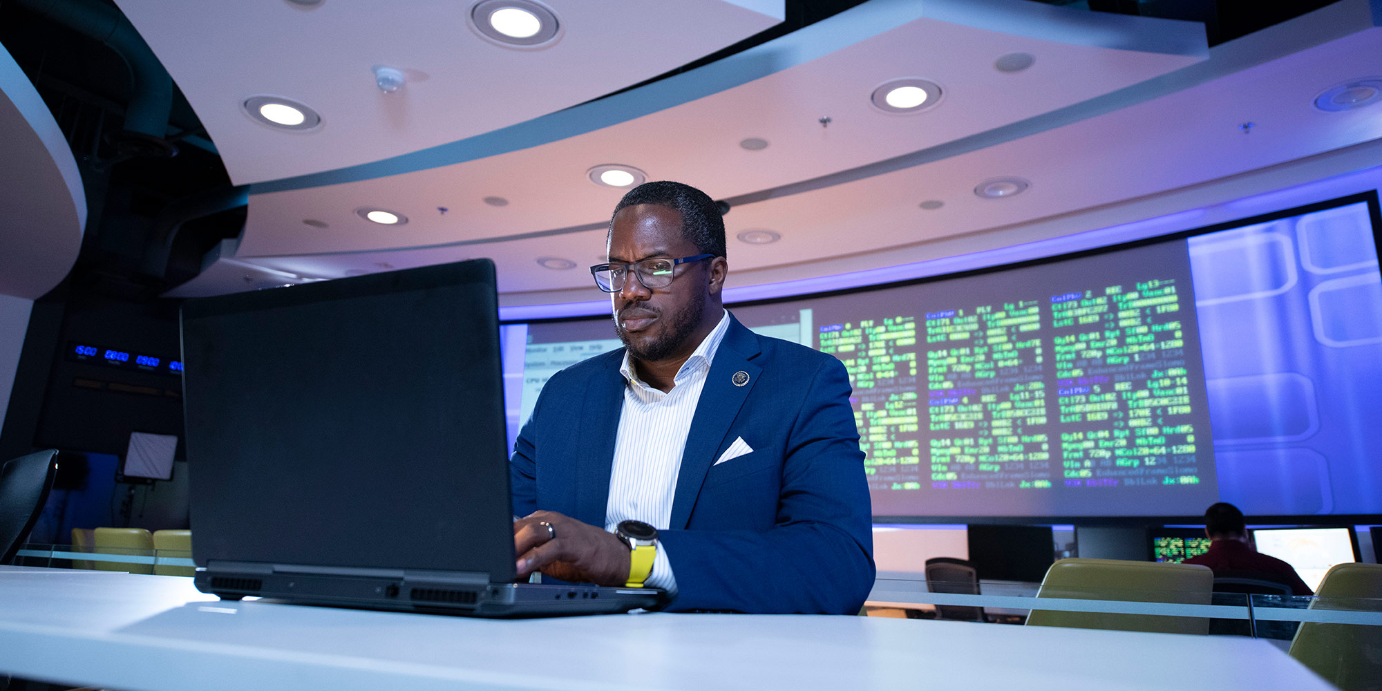 Diversity Drives Innovation at Northrop Grumman Black male on computer in cyber room