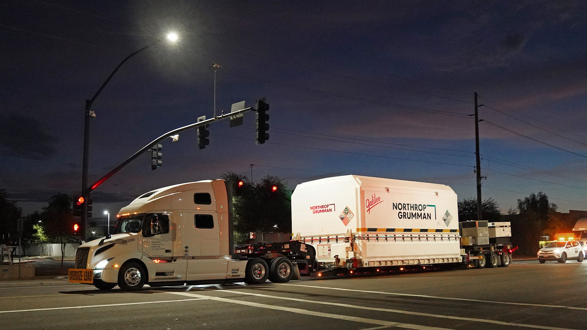 Tracker trailer carrying packaged spacecraft