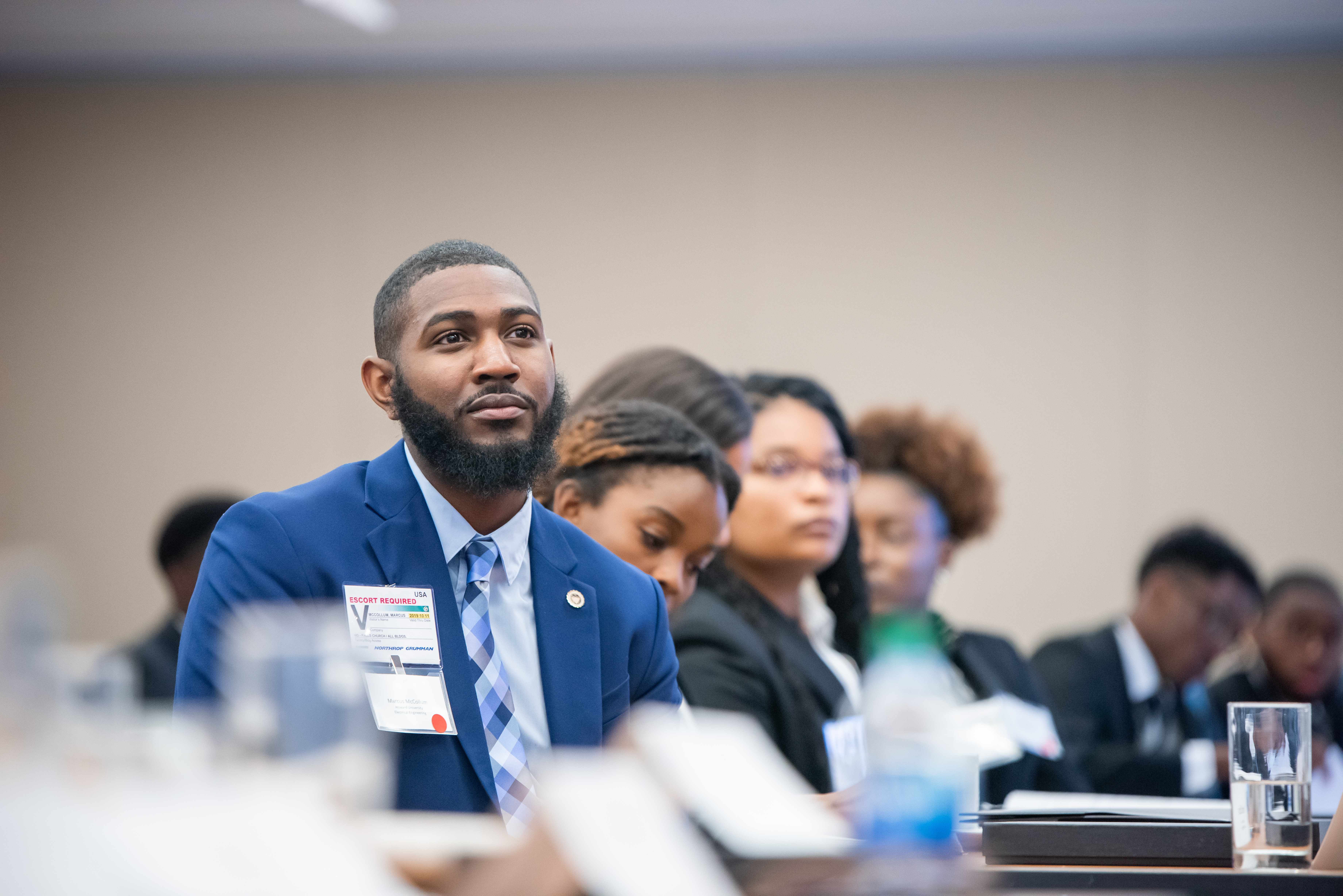 African american male listening to speaker