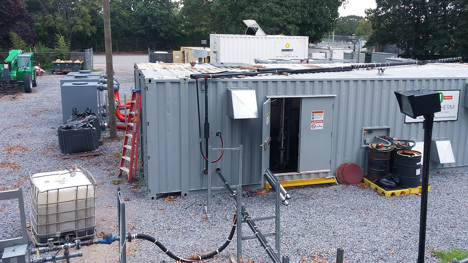 grey trailer on gravel bed