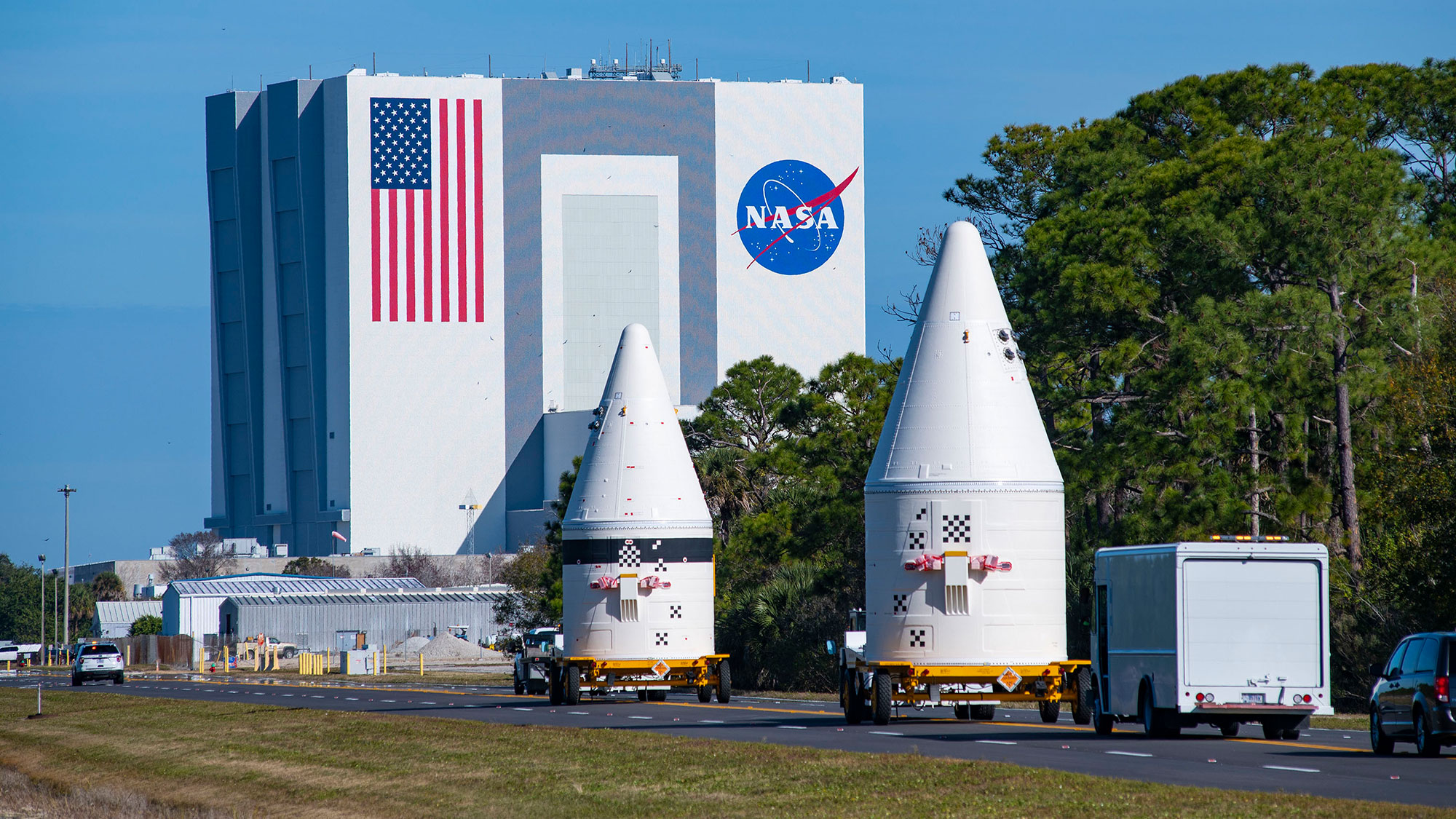 rockets on trailers heading to launch pad