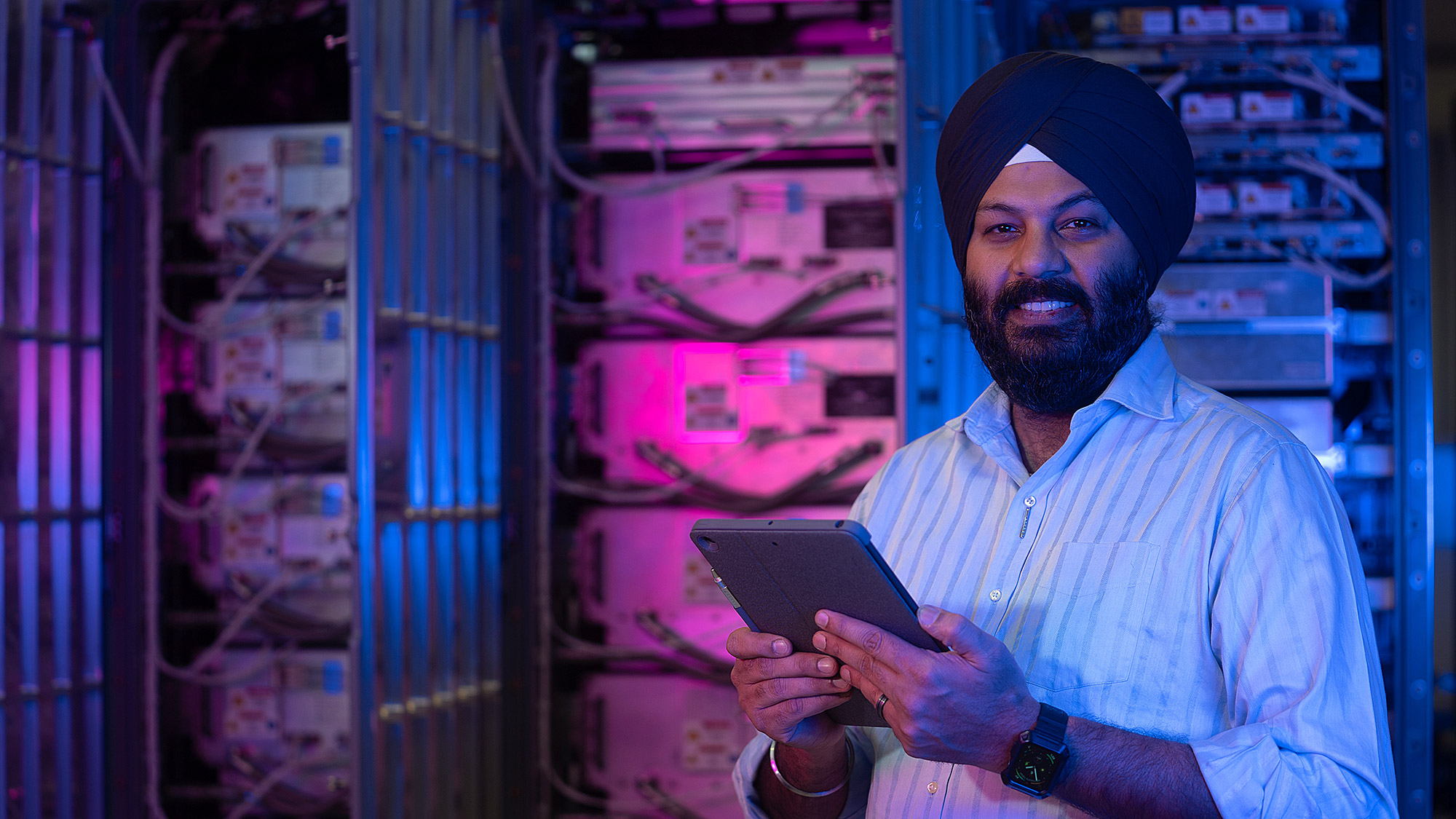 male standing in front of computer bay