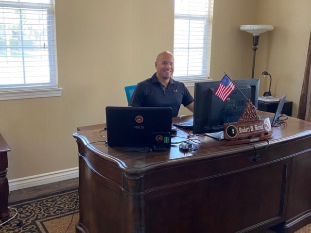 Rob Bernal_sitting at desk Career Transitions during the COVID Crisis and Beyond